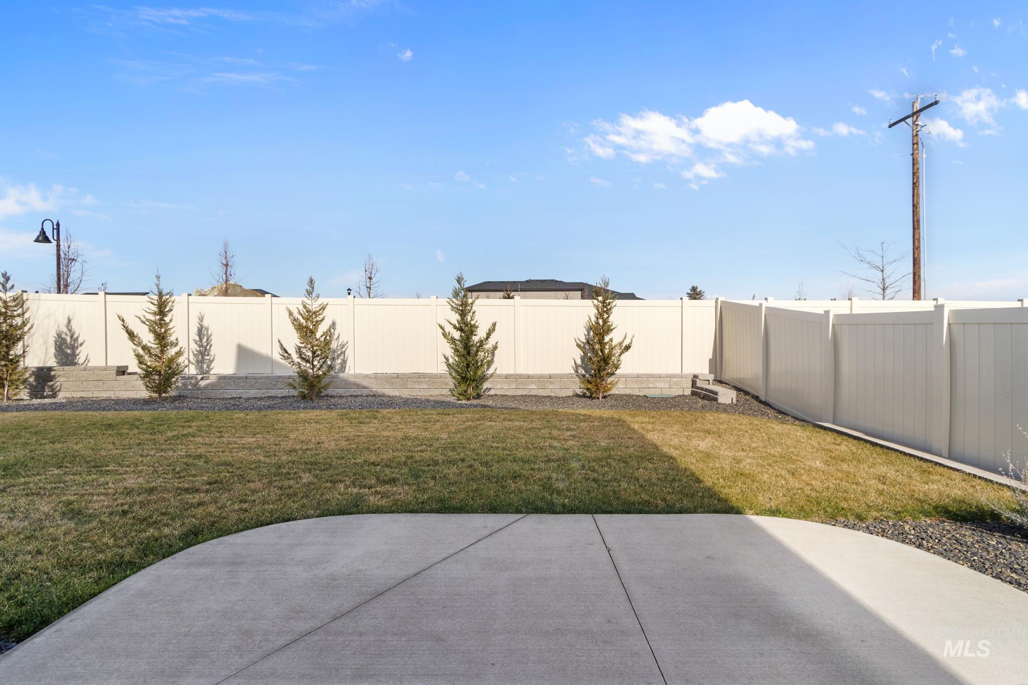9864 West Aviara Street Star, ID 83669 - Photo 34 of 40 Fenced backyard with a patio