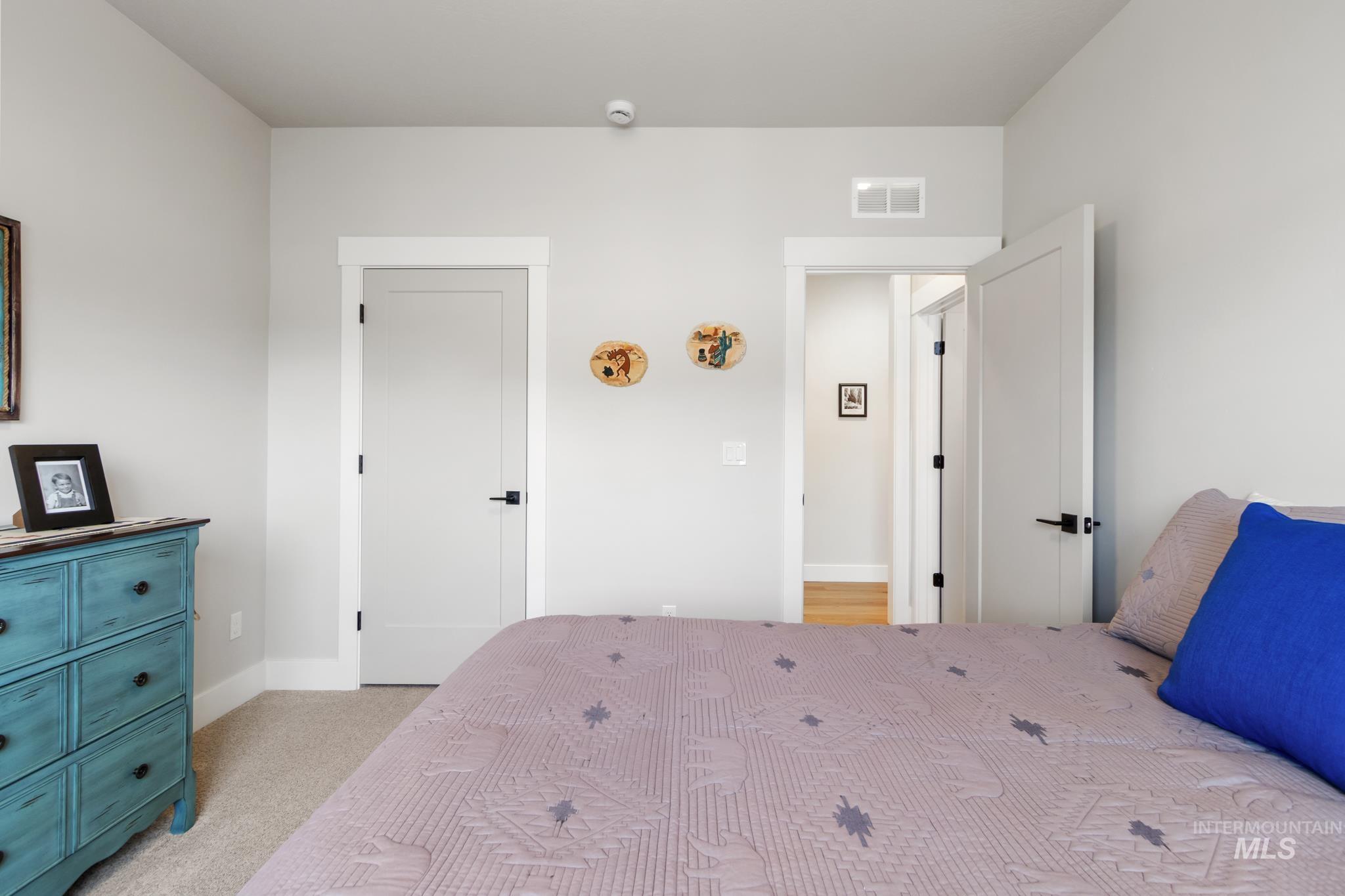 9864 West Aviara Street Star, ID 83669 - Photo 10 of 40 Bedroom featuring light carpet and baseboards