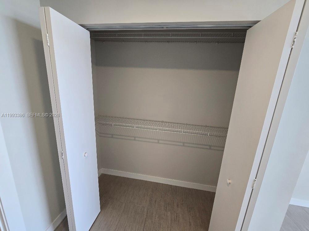 117 Southwest 10th Street, Unit 2105 Miami, FL 33130 - Photo 15 of 18 a view of walk in closet