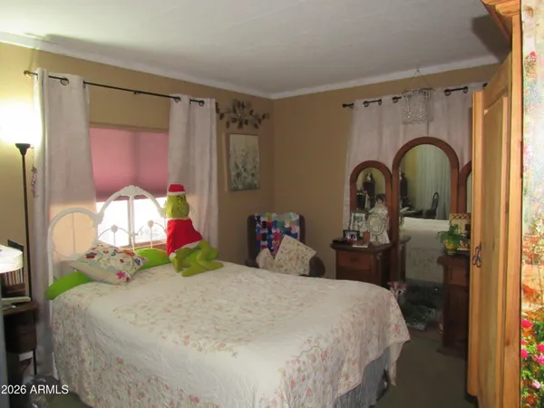 a bathroom with a toilet and a shower curtain