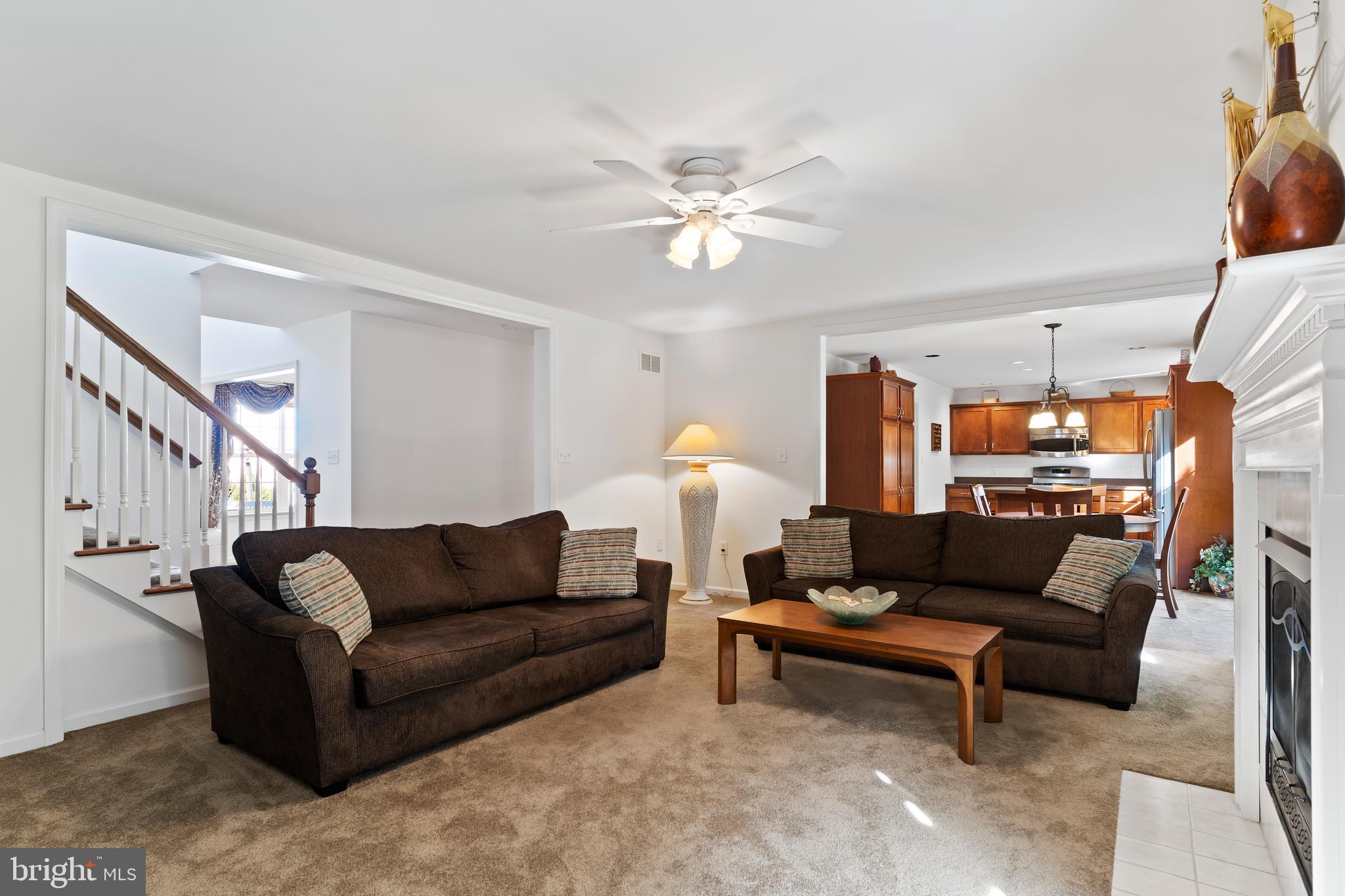 657 Hamaker Road Manheim, PA 17545 - Photo 13 of 41 a living room with furniture a rug and a chandelier