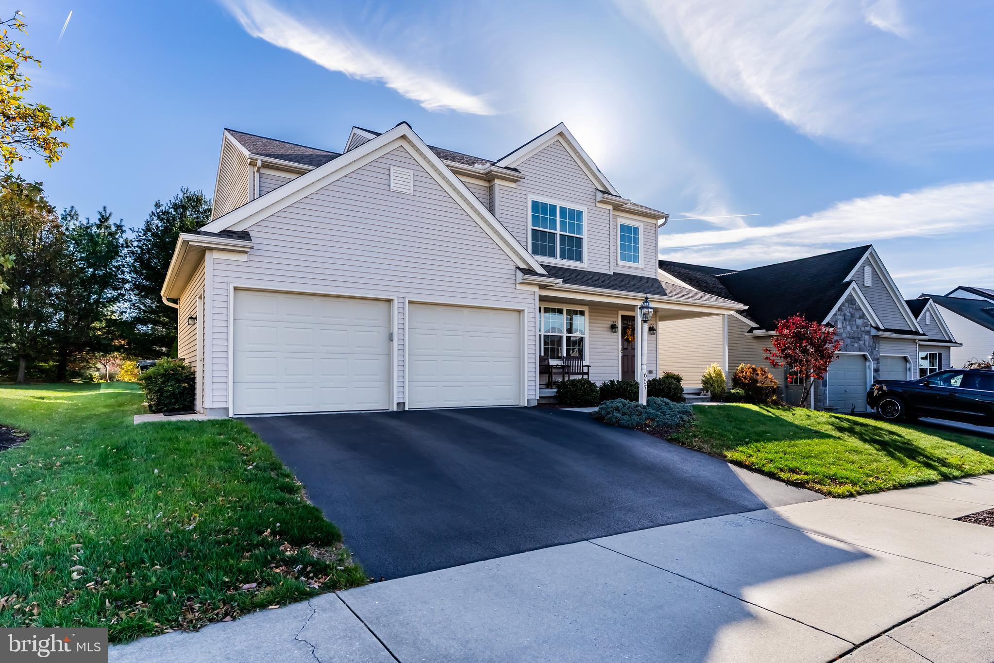 657 Hamaker Road Manheim, PA 17545 - Photo 41 of 41 a front view of a house with a yard and garage