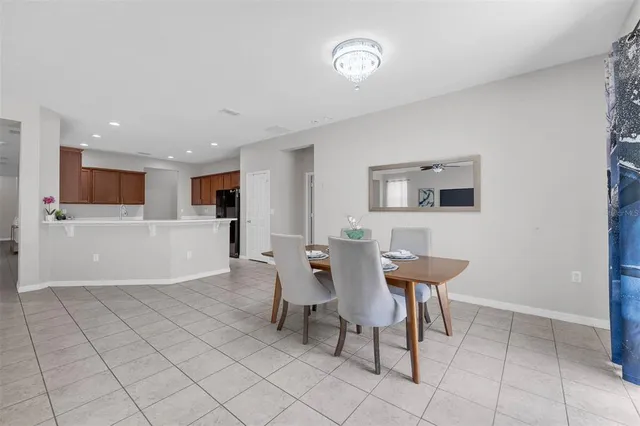 a dining room with furniture and window