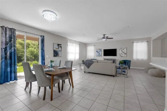 a kitchen with stainless steel appliances a refrigerator and a stove top oven