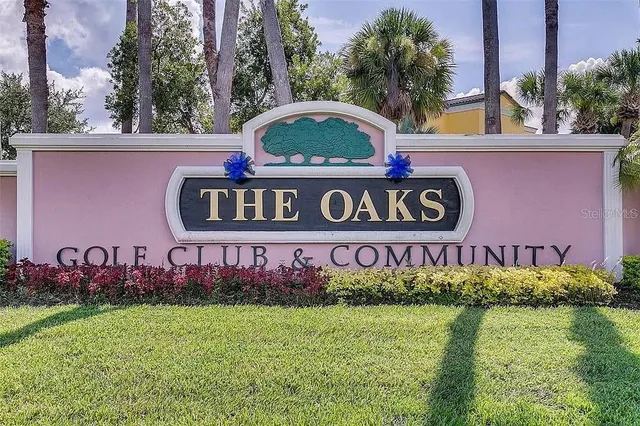 an aerial view of residential houses with outdoor space and swimming pool