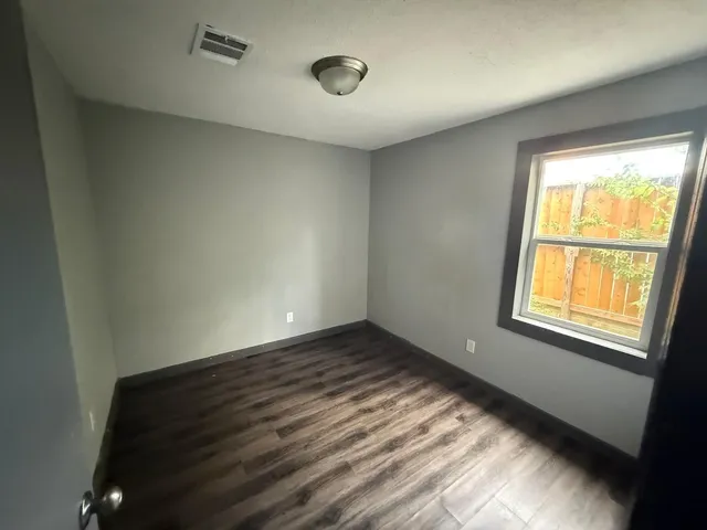 a view of an empty room and window