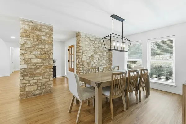 a view of a dining room with furniture window and wooden floor