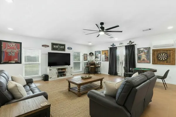 a view of a dining room with furniture window and wooden floor