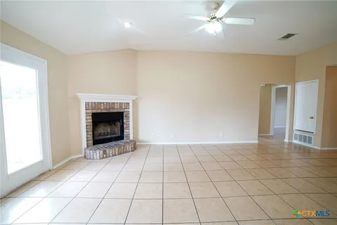 a view of an empty room with glass door