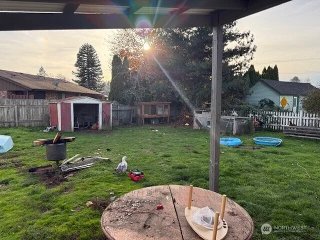 a view of a house with a backyard porch and sitting area