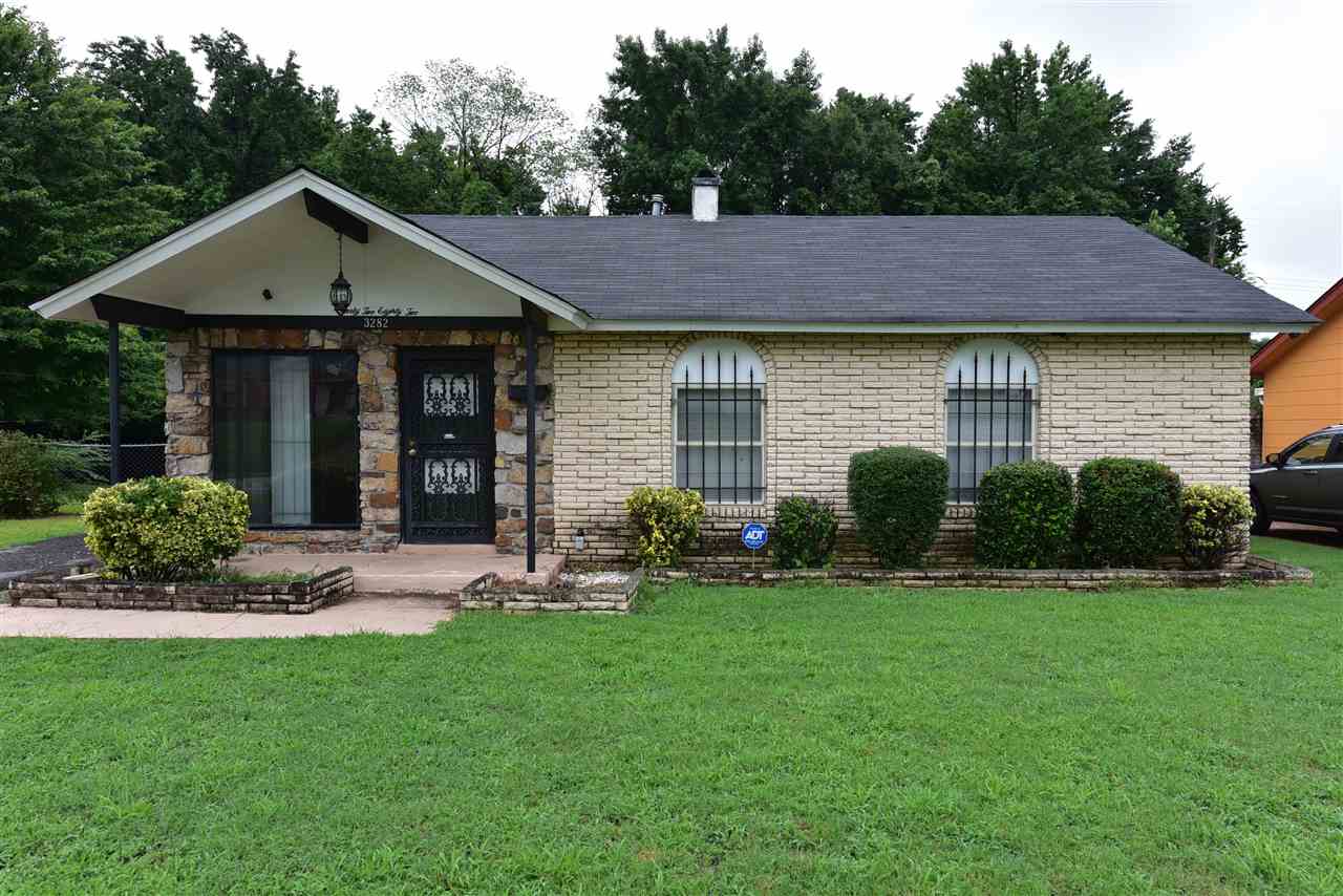 3282 Rochester Road Memphis, TN 38109 - Photo 1 of 21 a front view of a house with a yard