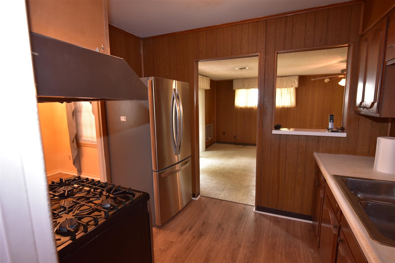 3282 Rochester Road Memphis, TN 38109 - Photo 15 of 21 a kitchen with stainless steel appliances granite countertop a refrigerator and a stove