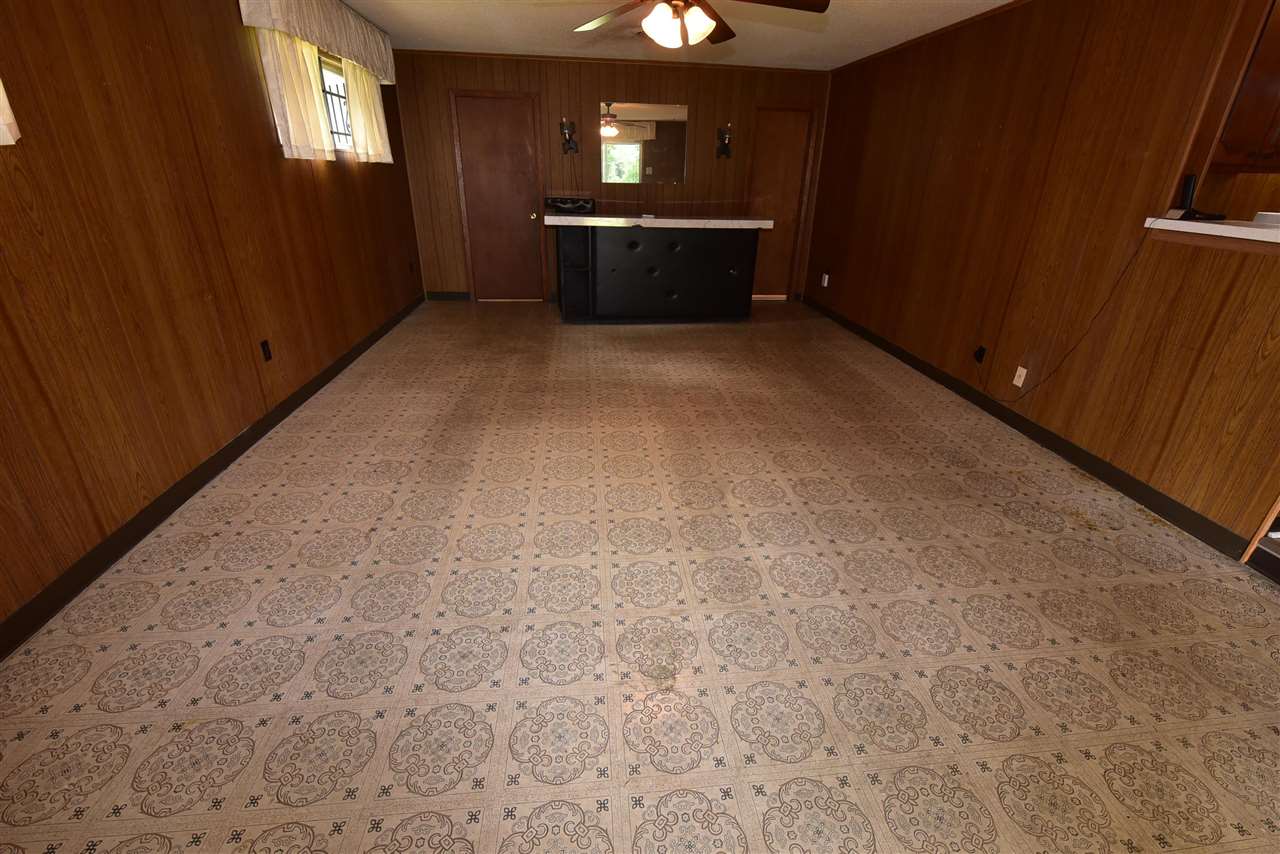 3282 Rochester Road Memphis, TN 38109 - Photo 17 of 21 an empty room with wooden floor and windows