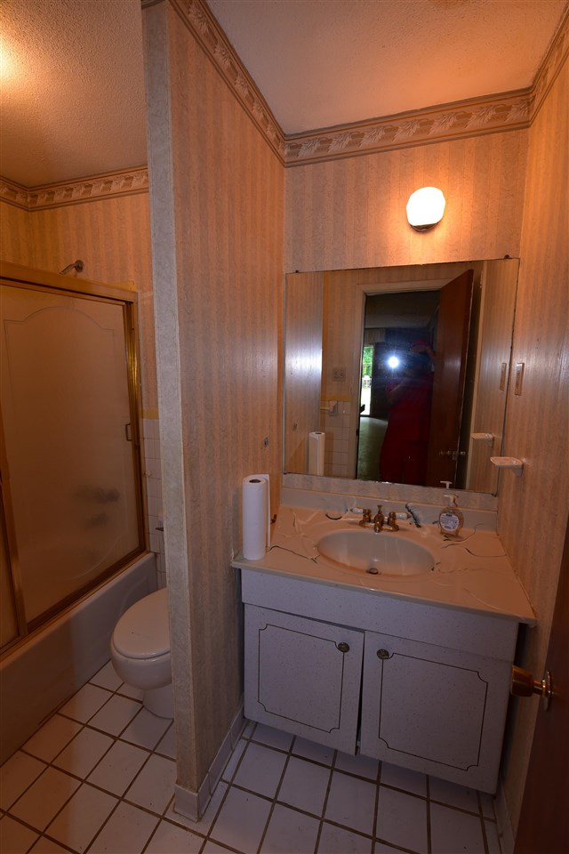 3282 Rochester Road Memphis, TN 38109 - Photo 19 of 21 a bathroom with a sink a toilet and mirror