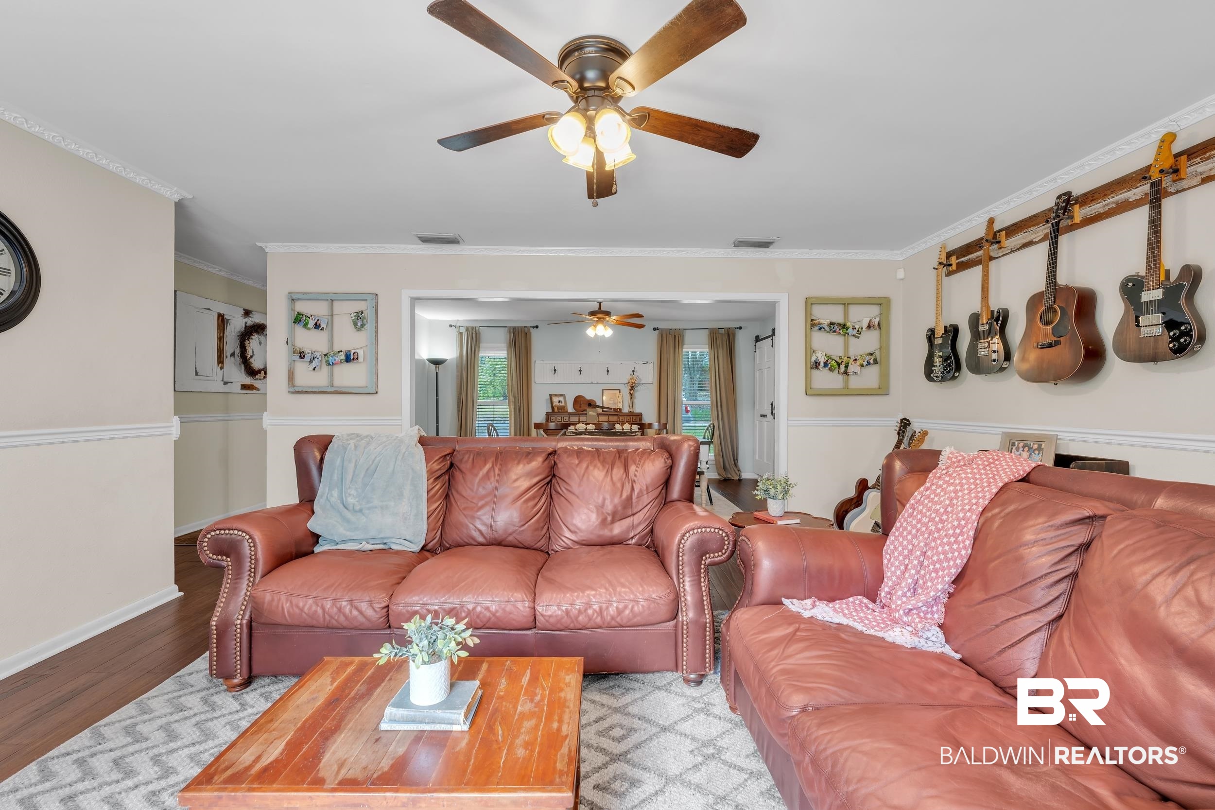 224 Cache Circle Mobile, AL 36611 - Photo 8 of 42 Living room with ceiling fan, crown molding, and wood finished floors