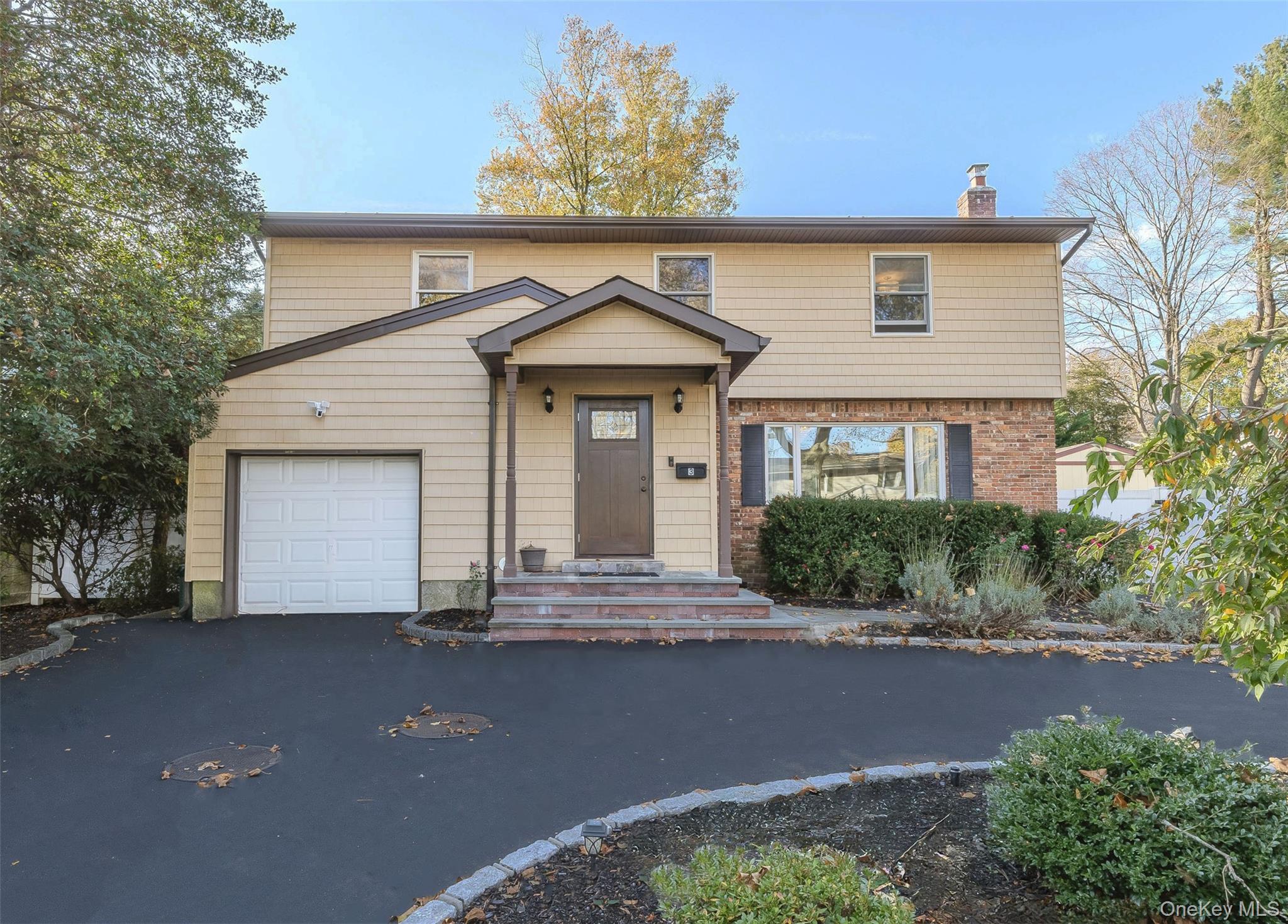 3 Earl Road Melville, NY 11747 - Photo 1 of 35 a front view of a house with yard and tress