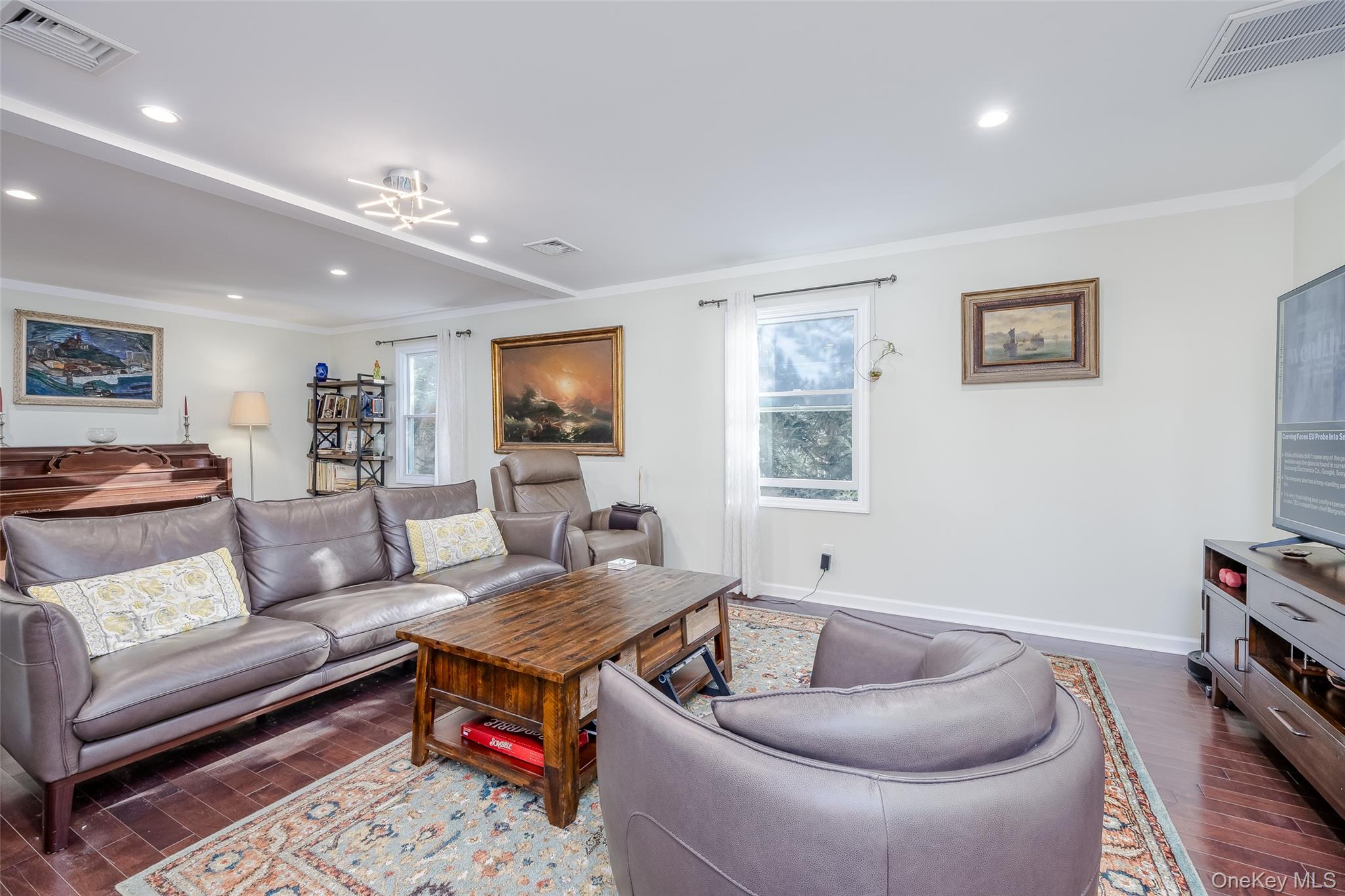 3 Earl Road Melville, NY 11747 - Photo 12 of 35 a living room with furniture and a wooden floor