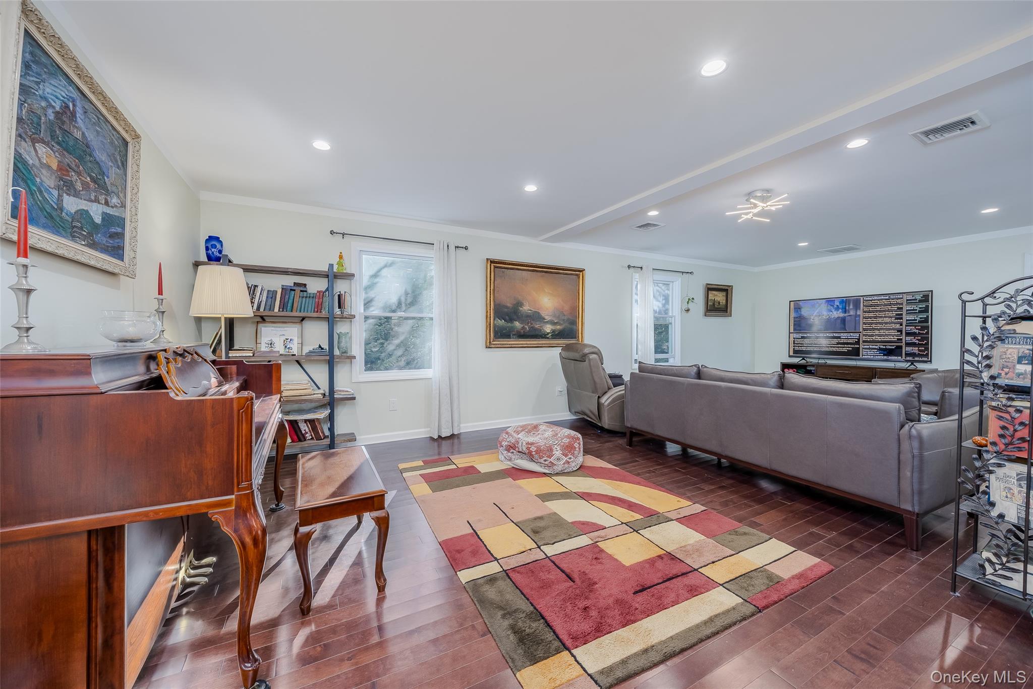 3 Earl Road Melville, NY 11747 - Photo 14 of 35 a living room with furniture and a flat screen tv