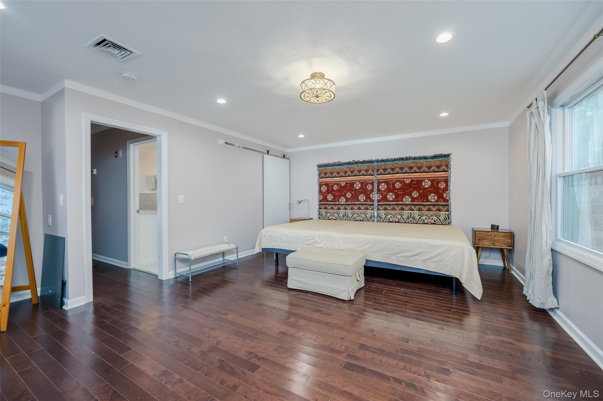 3 Earl Road Melville, NY 11747 - Photo 15 of 35 a view of a room with furniture and wooden floor