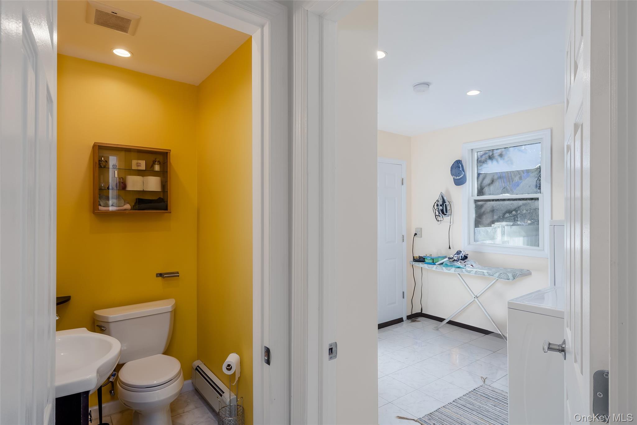 3 Earl Road Melville, NY 11747 - Photo 21 of 35 a bathroom with a toilet sink and shower