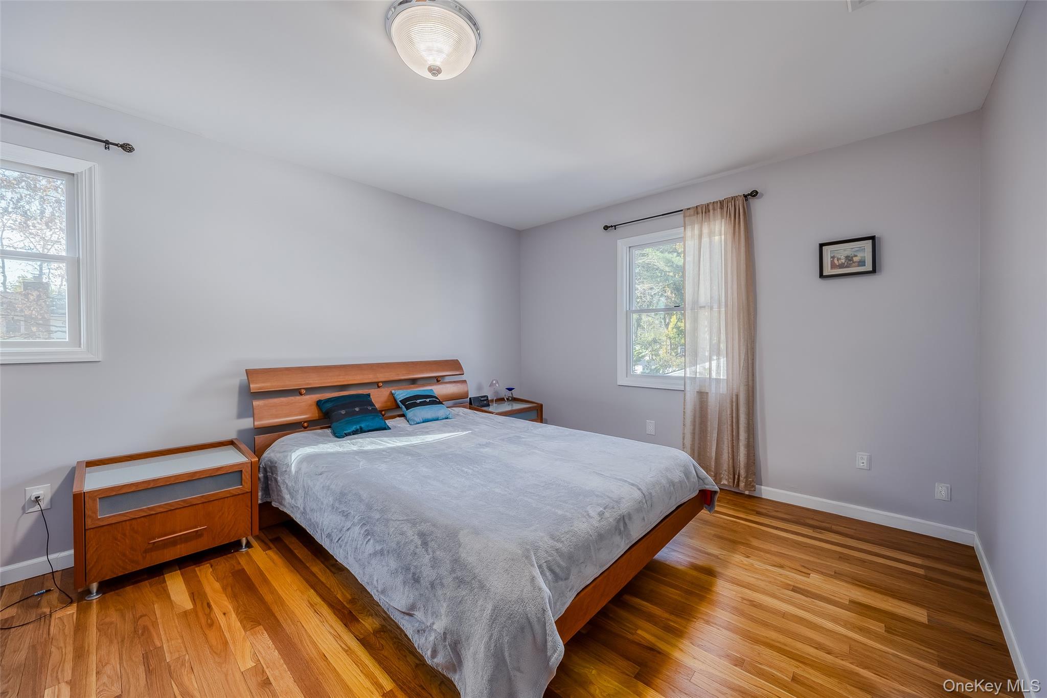 3 Earl Road Melville, NY 11747 - Photo 25 of 35 a bedroom with a bed and window