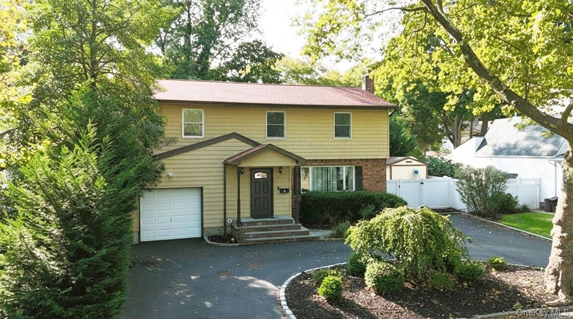 3 Earl Road Melville, NY 11747 - Photo 33 of 35 a view of a house with a yard