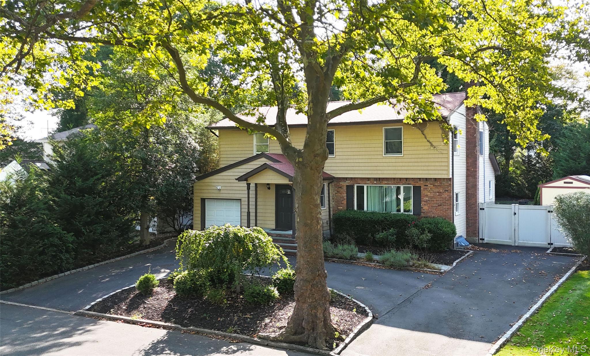 3 Earl Road Melville, NY 11747 - Photo 34 of 35 a front view of house with yard and green space