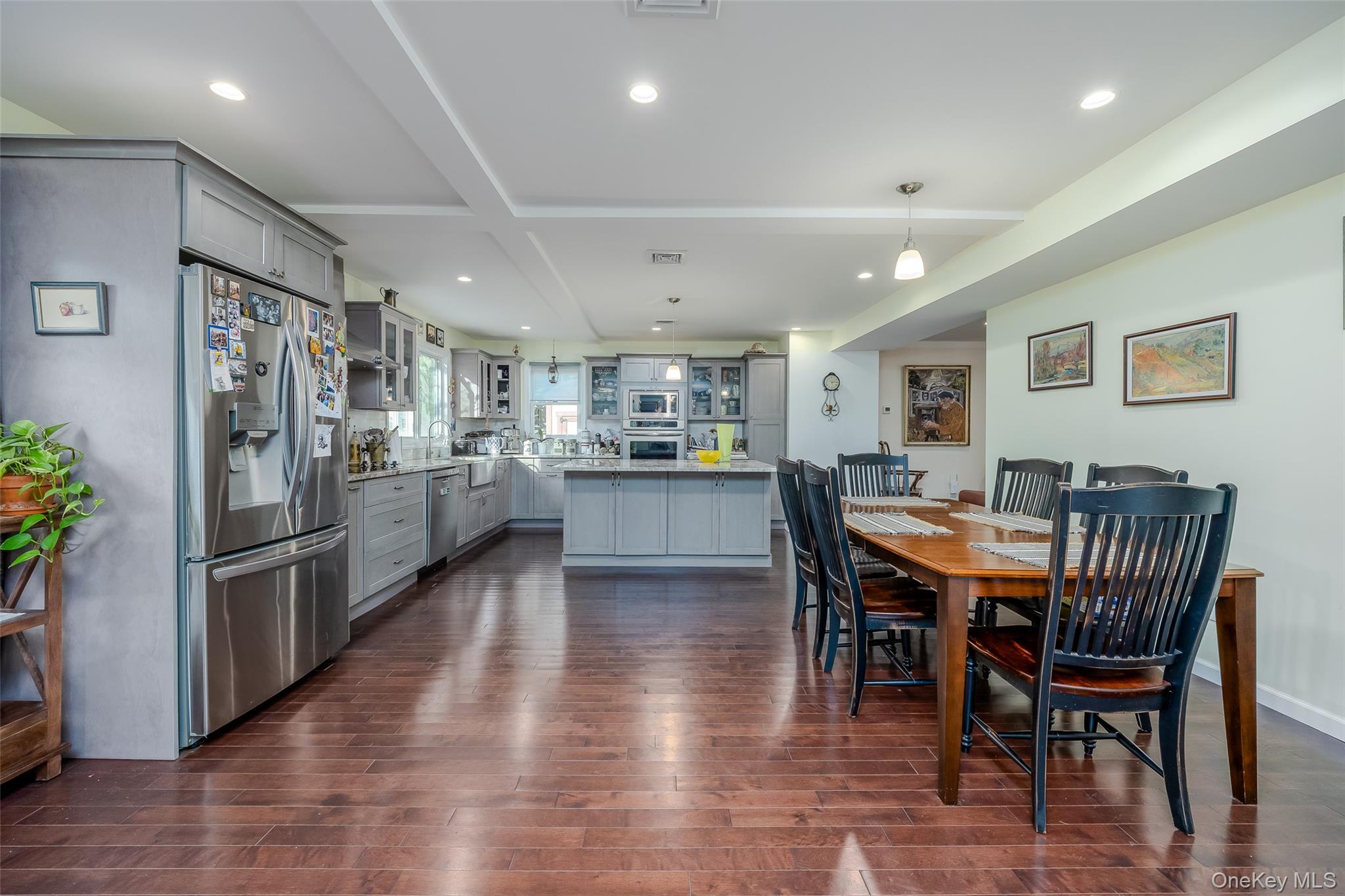 3 Earl Road Melville, NY 11747 - Photo 4 of 35 a view of kitchen with refrigerator and wooden floor