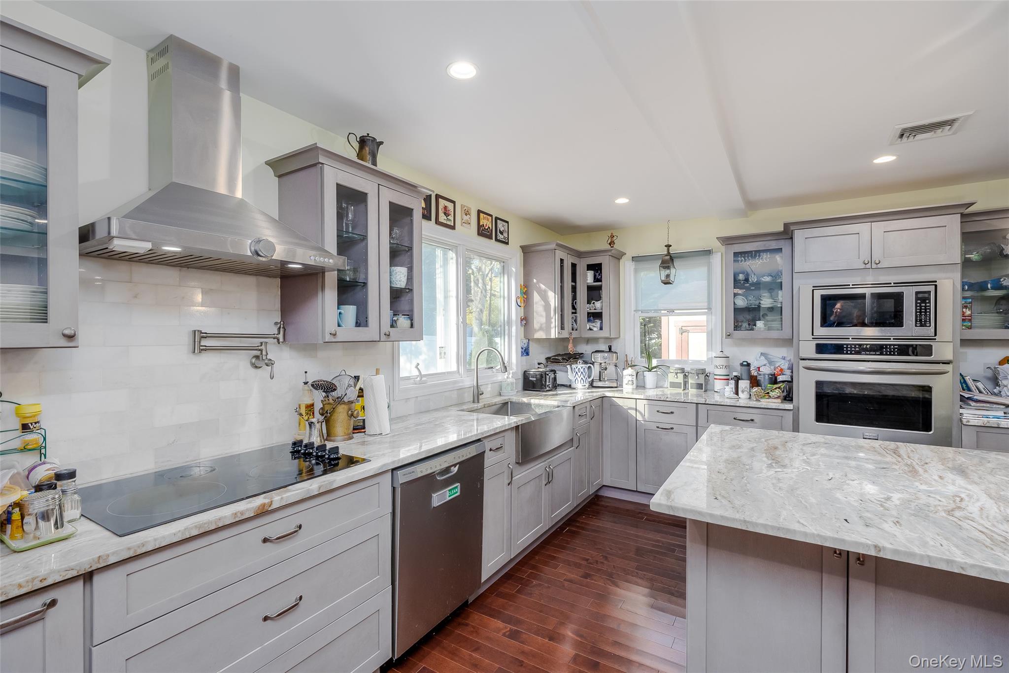 3 Earl Road Melville, NY 11747 - Photo 6 of 35 a kitchen with a sink stainless steel appliances and cabinets