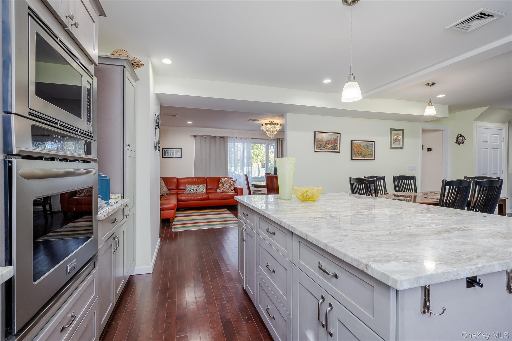 3 Earl Road Melville, NY 11747 - Photo 7 of 35 a view living room with furniture and flat screen tv