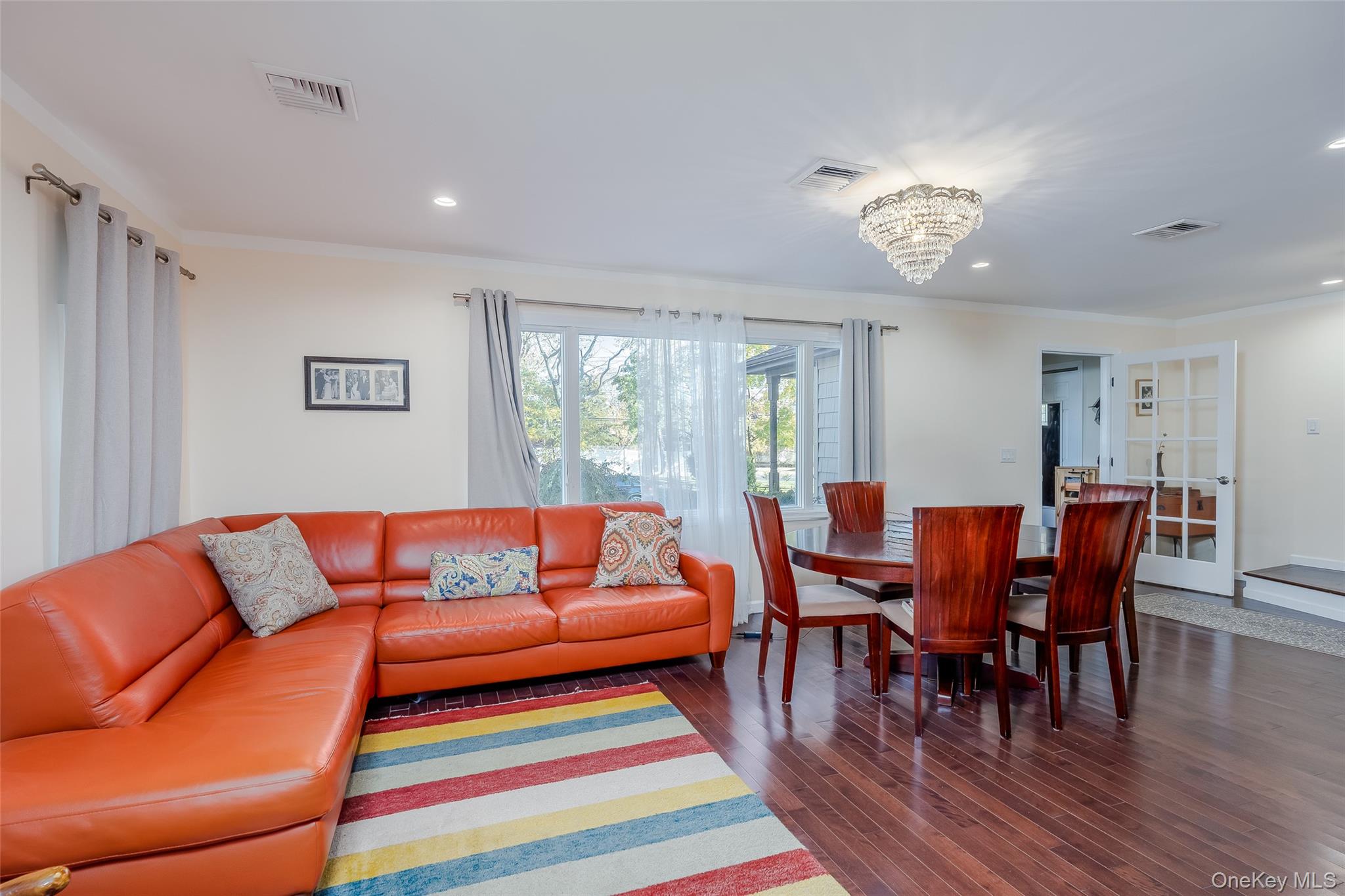 3 Earl Road Melville, NY 11747 - Photo 9 of 35 a living room with furniture wooden floor and dining table