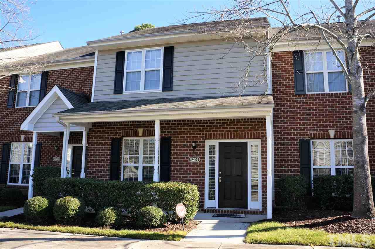 9204 Grassington Way Raleigh, NC 27615 - Photo 2 of 29 a front view of a house with a yard