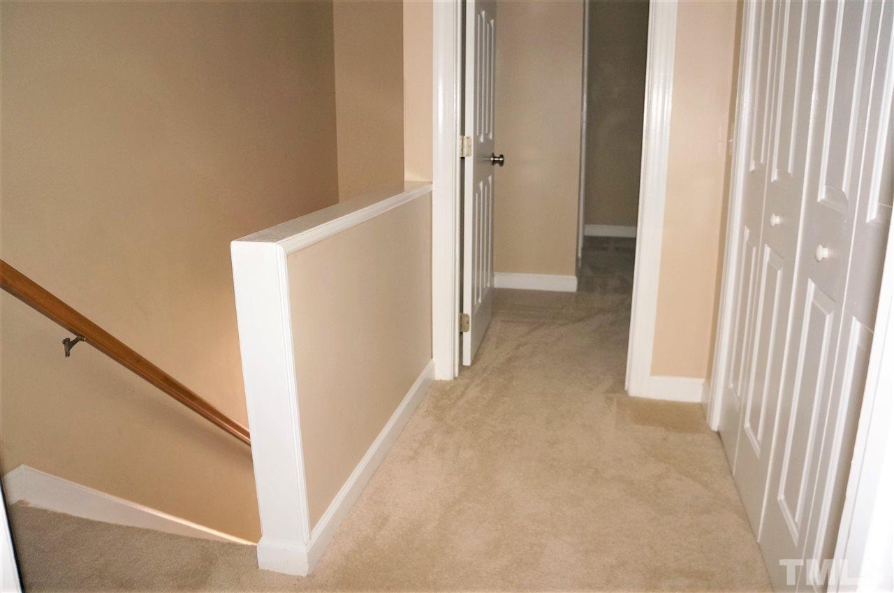 9204 Grassington Way Raleigh, NC 27615 - Photo 14 of 29 a view of a hallway with hallway and stairs