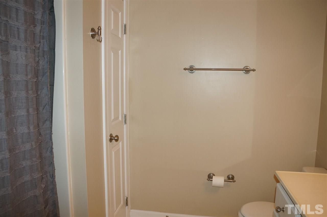 9204 Grassington Way Raleigh, NC 27615 - Photo 21 of 29 a bathroom with a granite countertop toilet and a sink