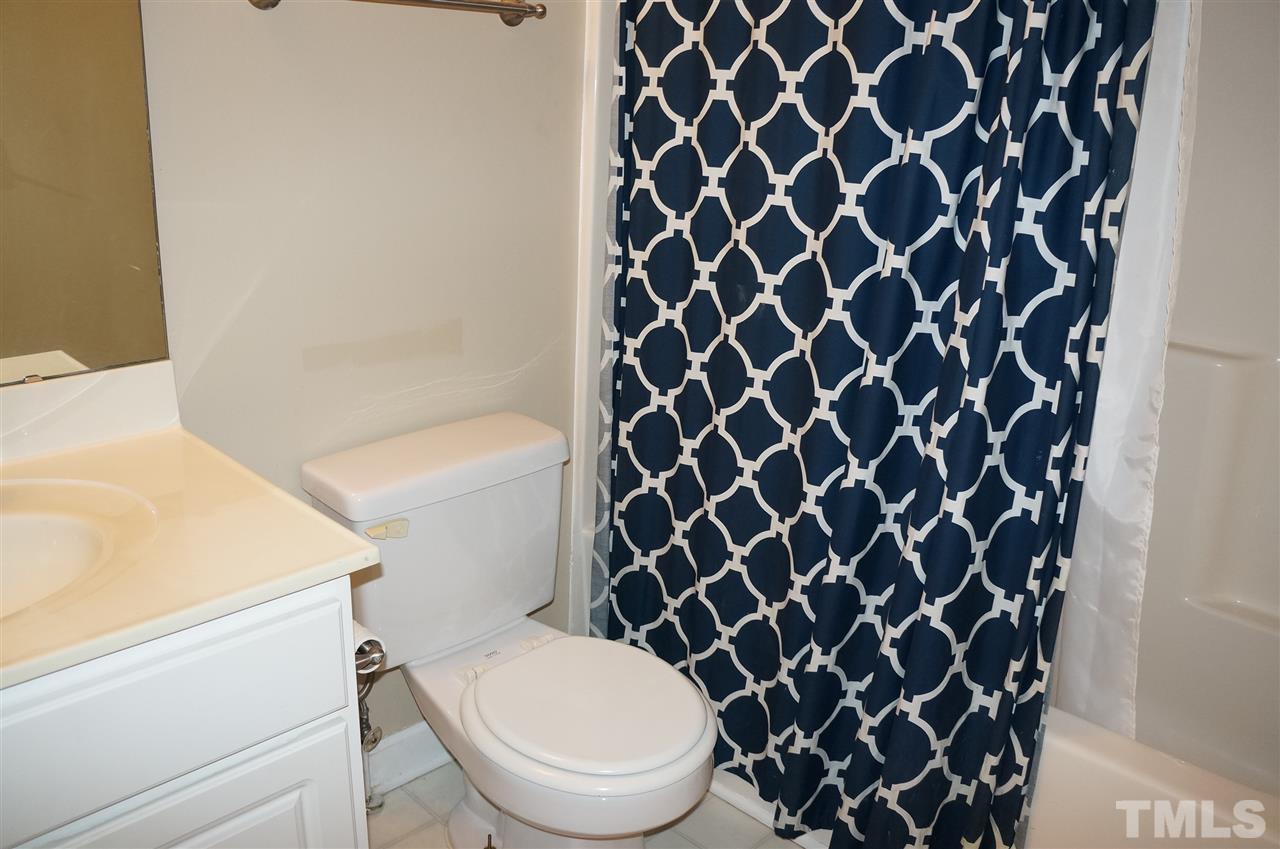 9204 Grassington Way Raleigh, NC 27615 - Photo 25 of 29 a white toilet sitting next to a white wall