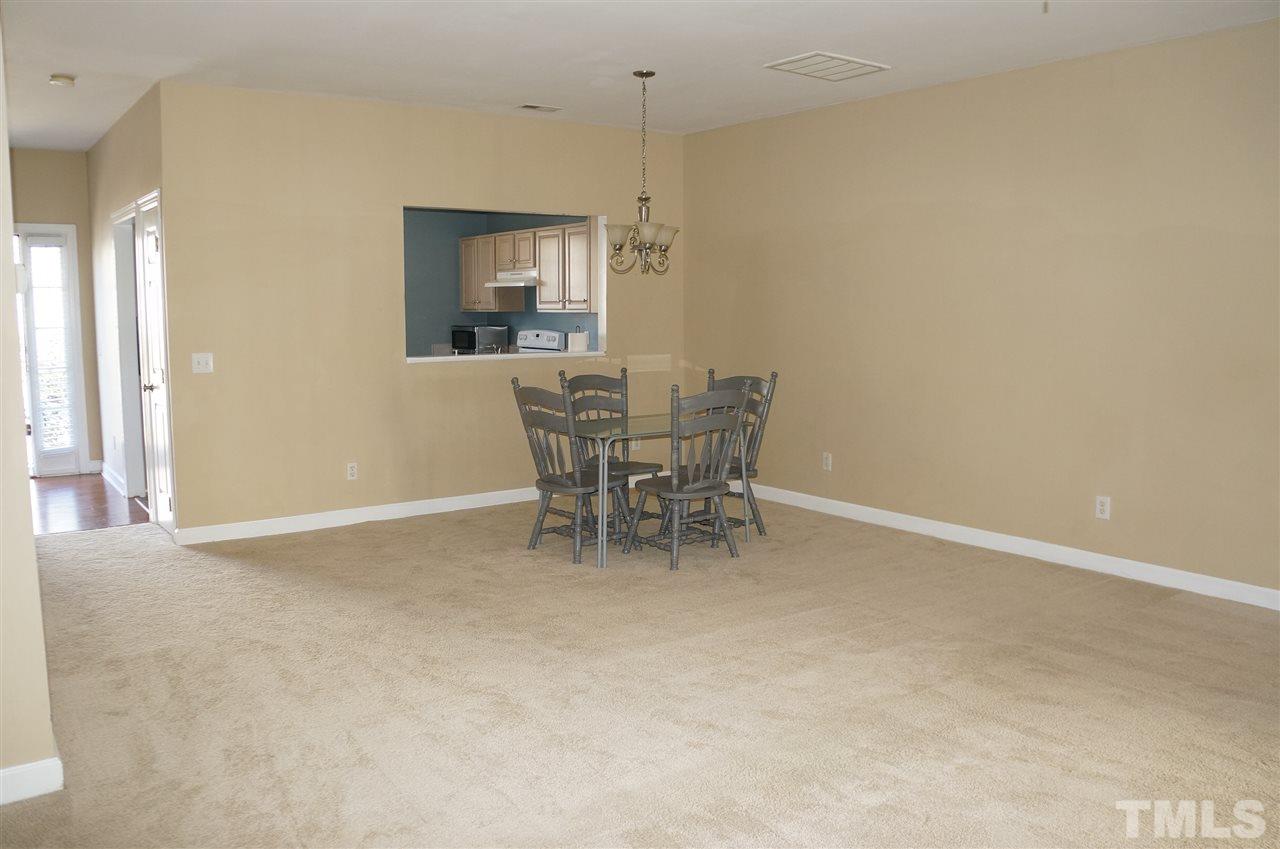 9204 Grassington Way Raleigh, NC 27615 - Photo 6 of 29 a dining room with furniture and a window