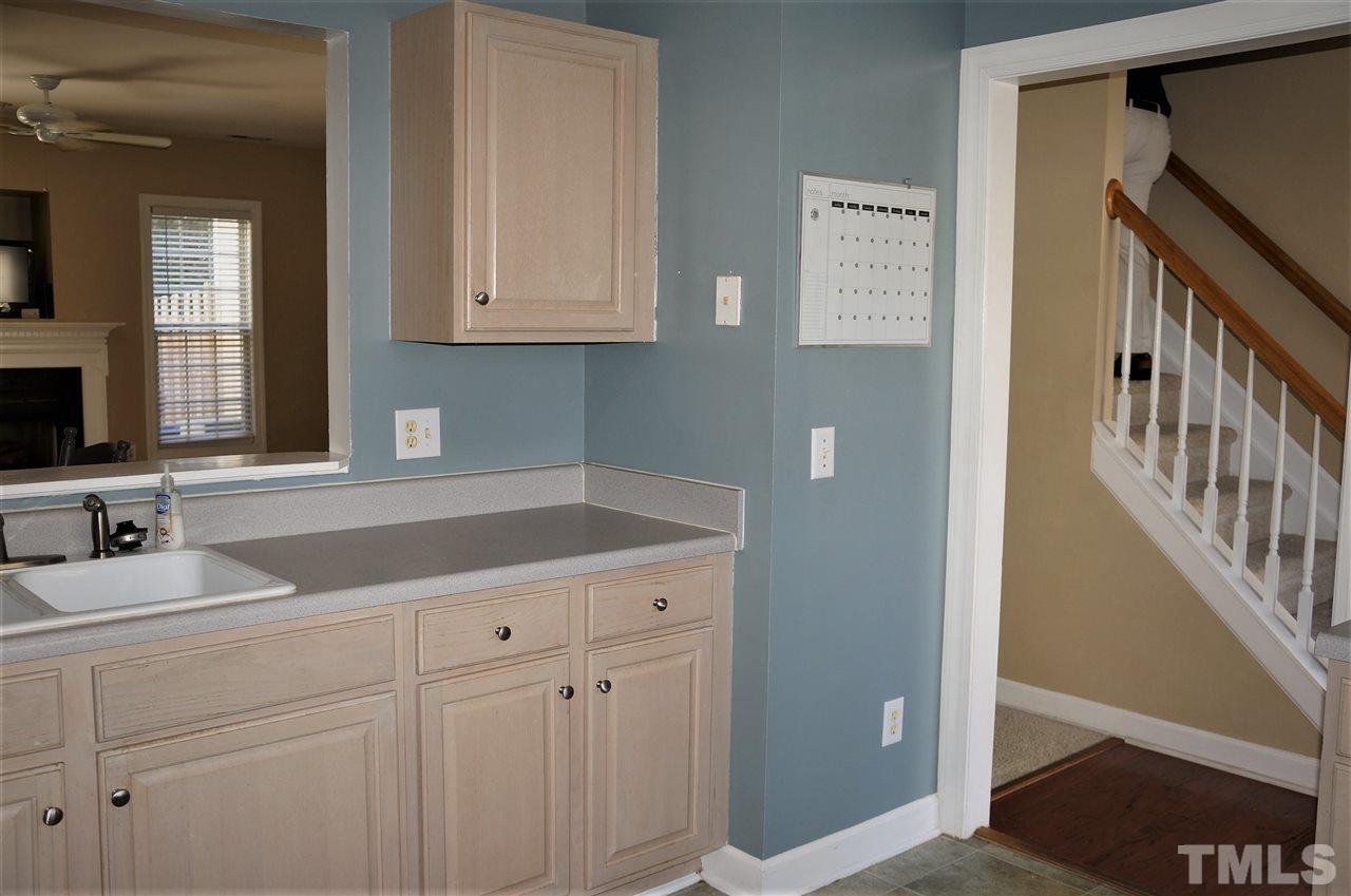 9204 Grassington Way Raleigh, NC 27615 - Photo 10 of 29 a bathroom with a sink and a mirror