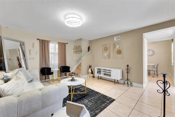 a living room with furniture and a table