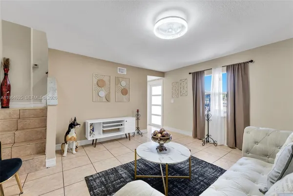 a living room with furniture and a window