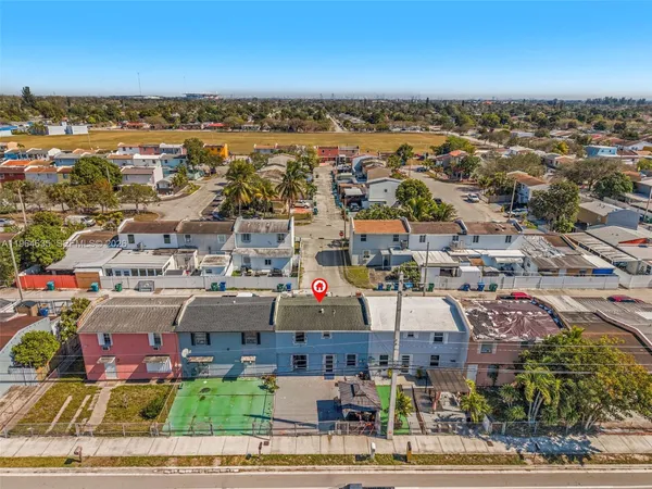 an aerial view of a city with lots of residential buildings