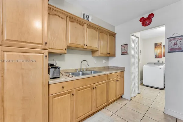 a kitchen with cabinets and white appliances