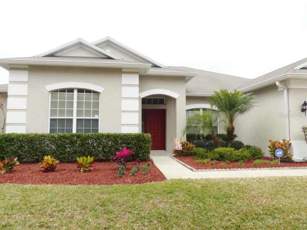 13521 Old Dock Road Orlando, FL 32828 - Photo 1 of 1 a front view of a house with a yard