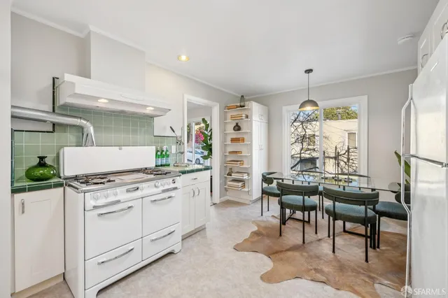 a bed room with two beds and a chair