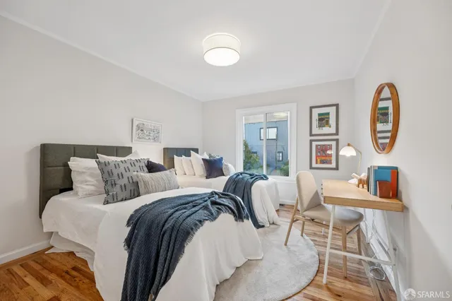 a view of a dining room with furniture and a mirror