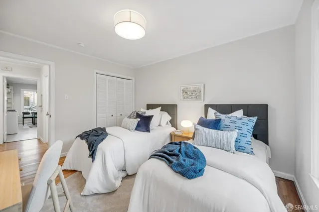 a spacious bedroom with a bed and window