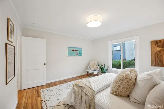 a bed room with a bed and a lamp