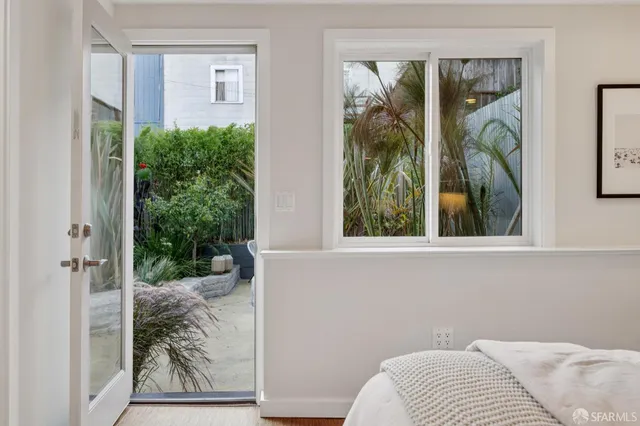 a bathroom with a shower sink and mirror