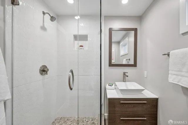 a bathroom with a sink and a mirror