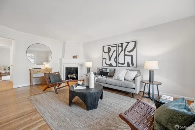 a living room with furniture rug and window
