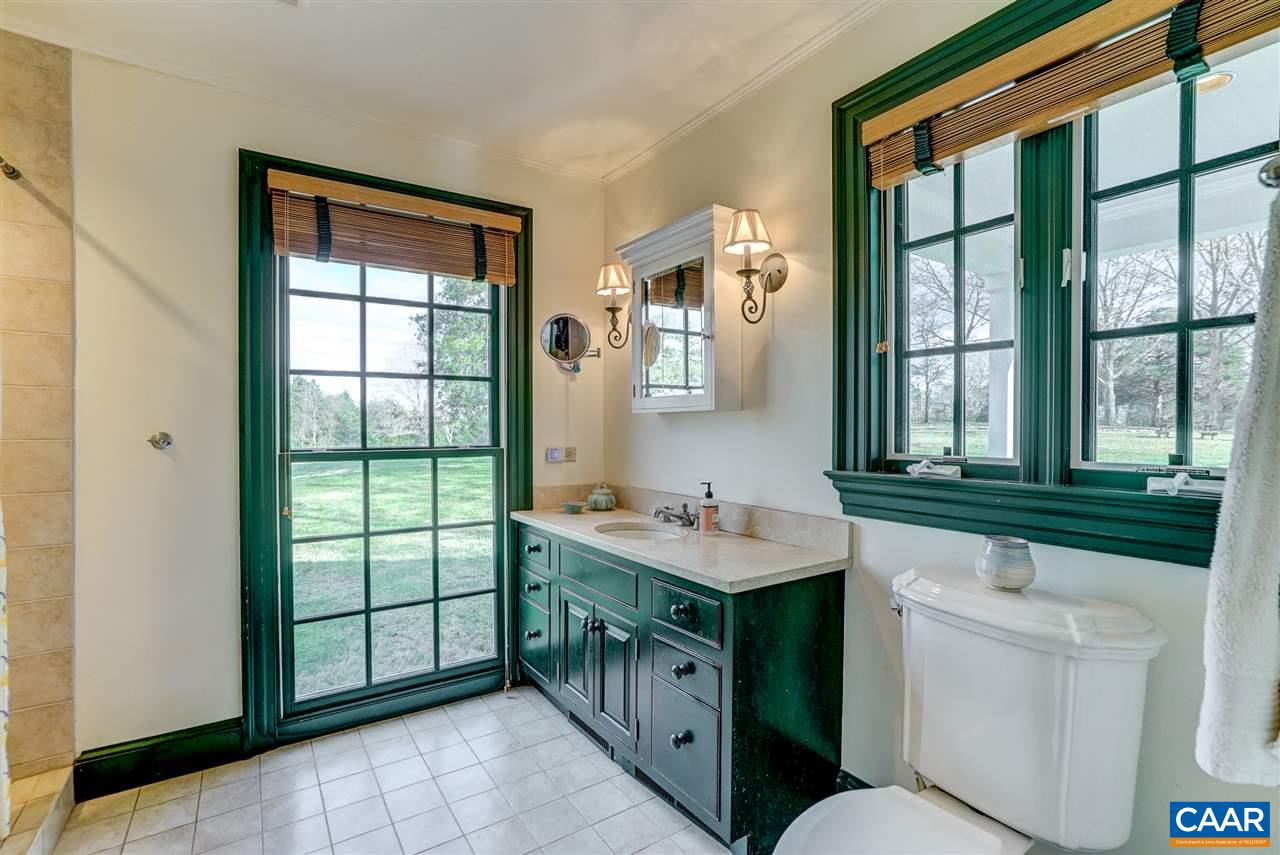 5120 Rutherford Road Free Union, VA 22901 - Photo 23 of 39 a bathroom with a sink a toilet and a shower